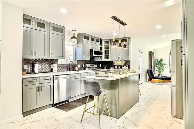 a kitchen with a sink and cabinets