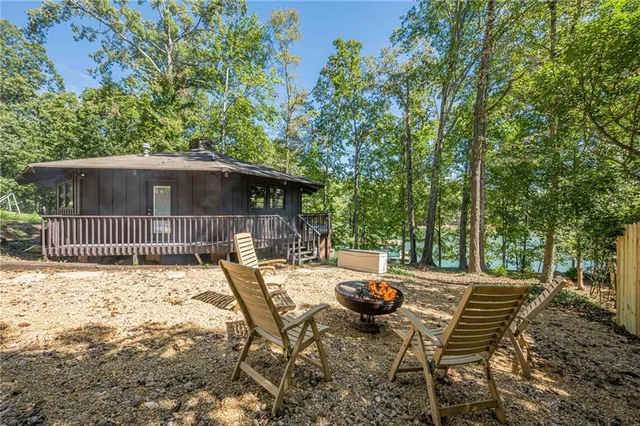 a view of backyard with sitting area