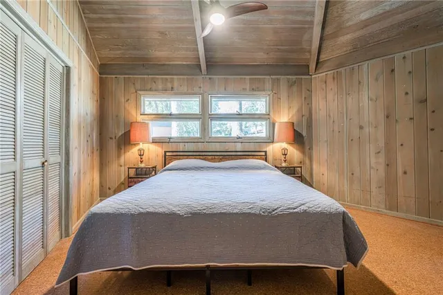 a bedroom with a bed and a table