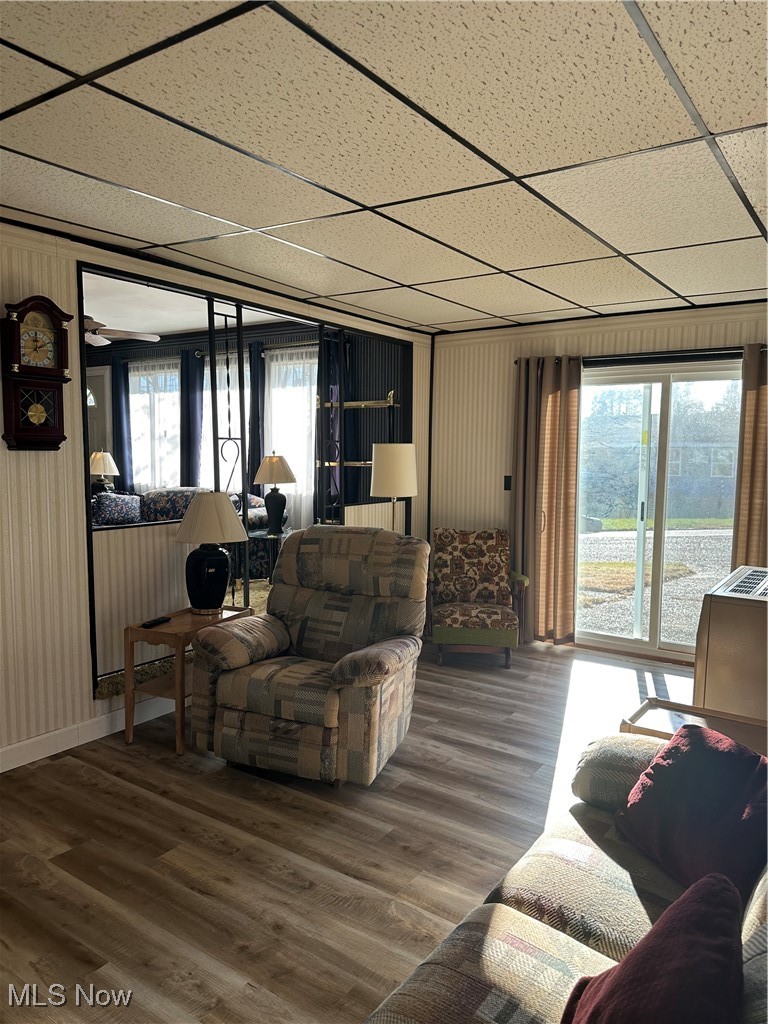 314 Devon Road Woodsfield, OH 43793 - Photo 26 of 50 Living area with wood finished floors and a paneled ceiling