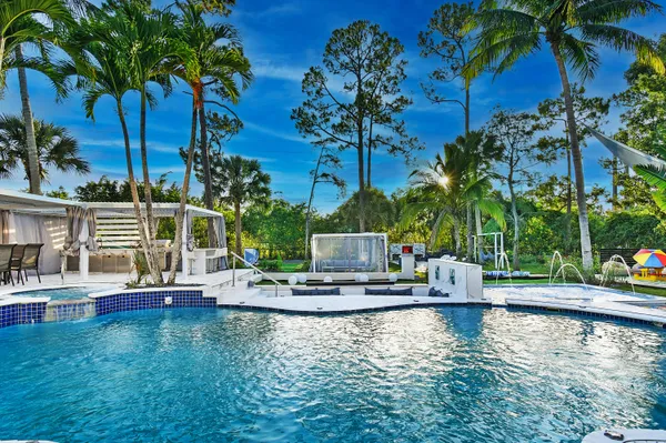 a view of a swimming pool with a sitting space
