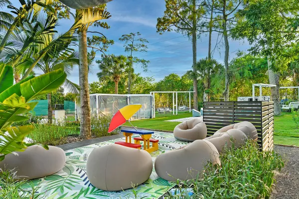 a view of a backyard with plants and a patio