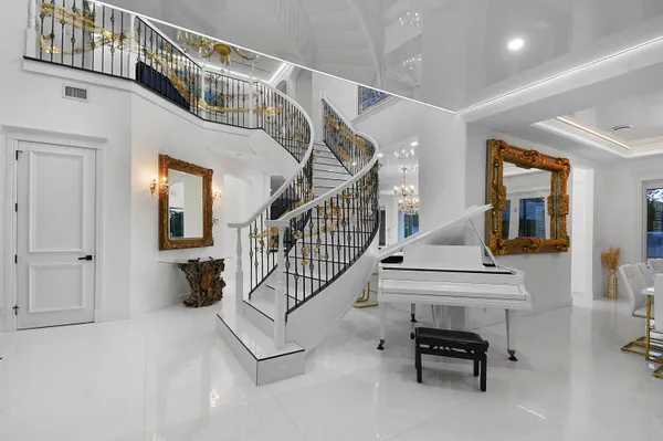 a living room with furniture and a clock