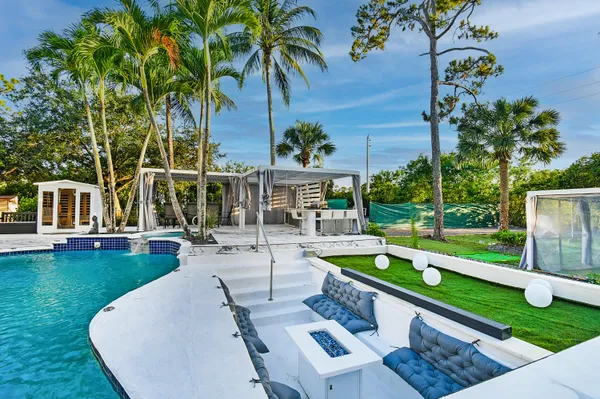 swimming pool view with a outdoor seating space