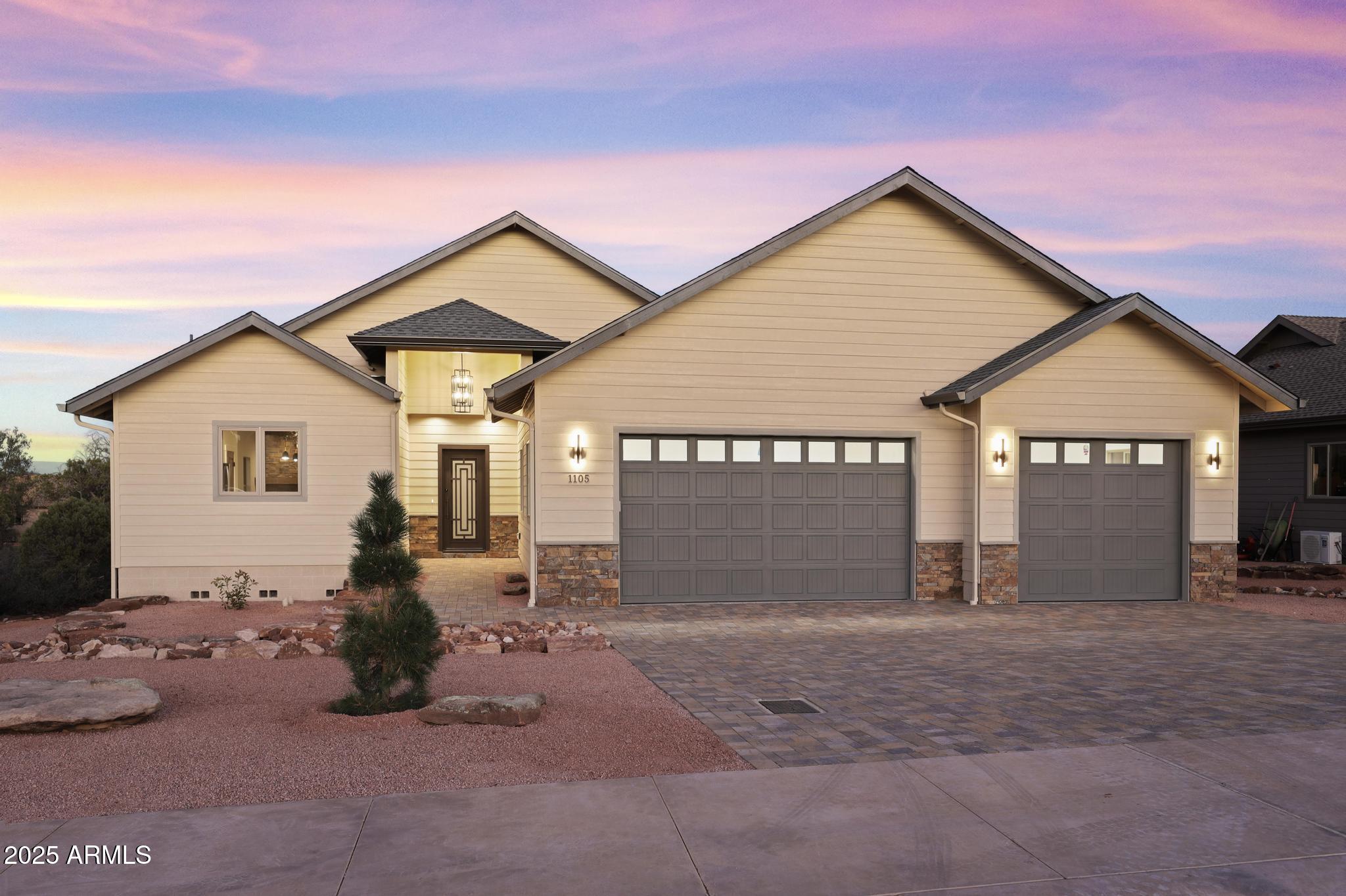 a view of a house with a yard and garage