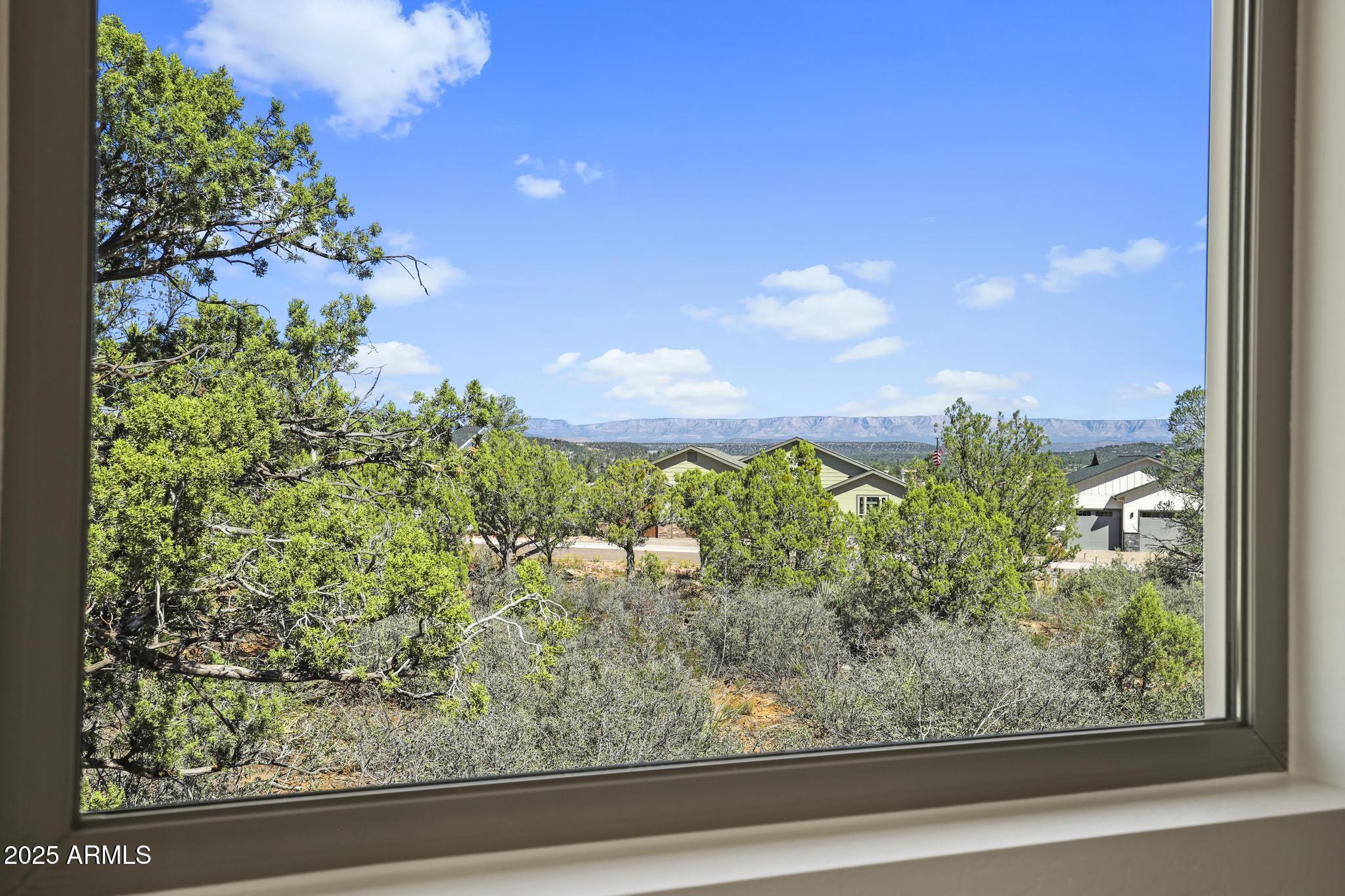 1105 South Kinzer Court Payson, AZ 85541 - Photo 11 of 44 a view of a garden from a window