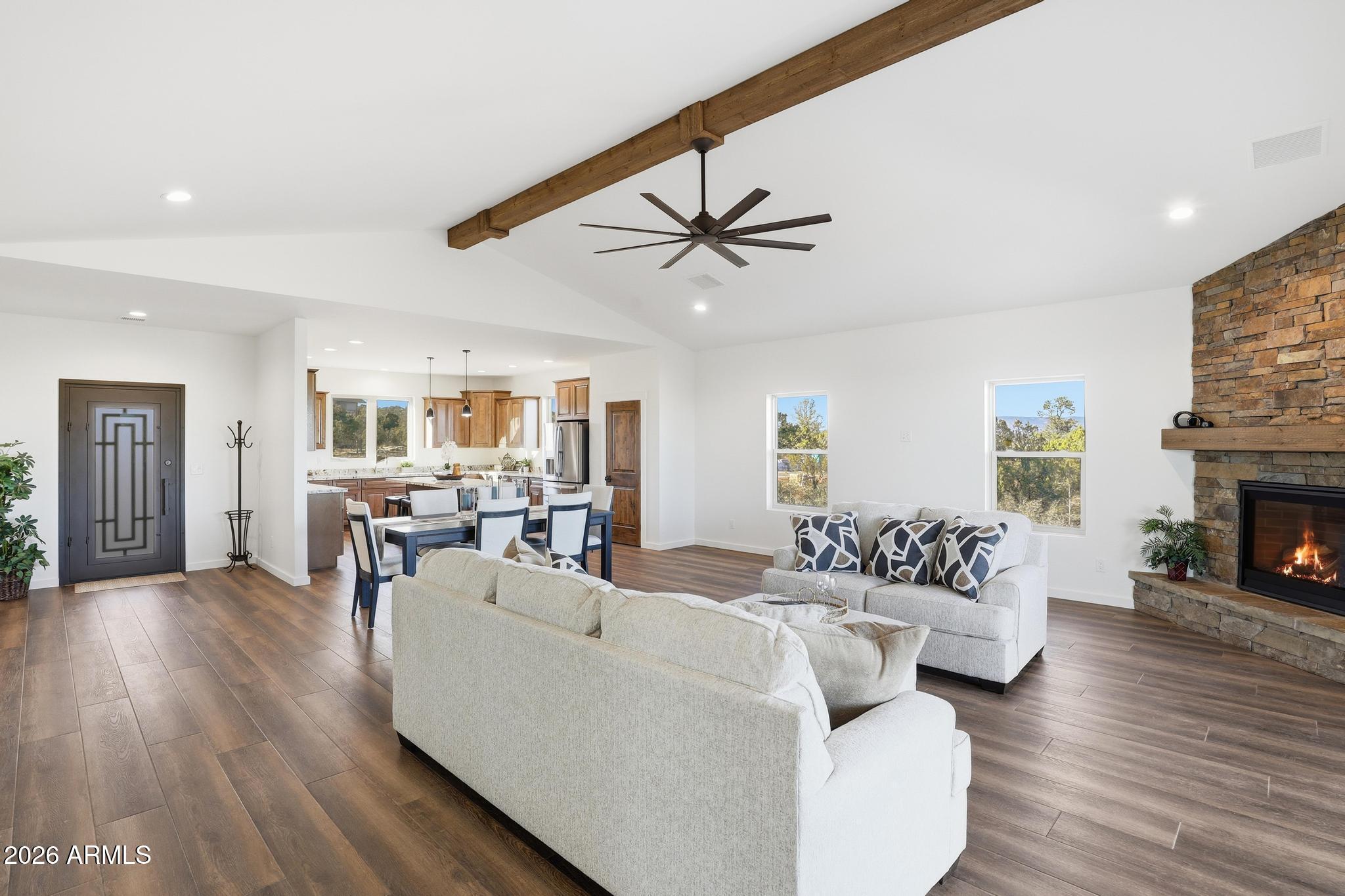 1105 South Kinzer Court Payson, AZ 85541 - Photo 12 of 44 a living room with fireplace furniture and a wooden floor