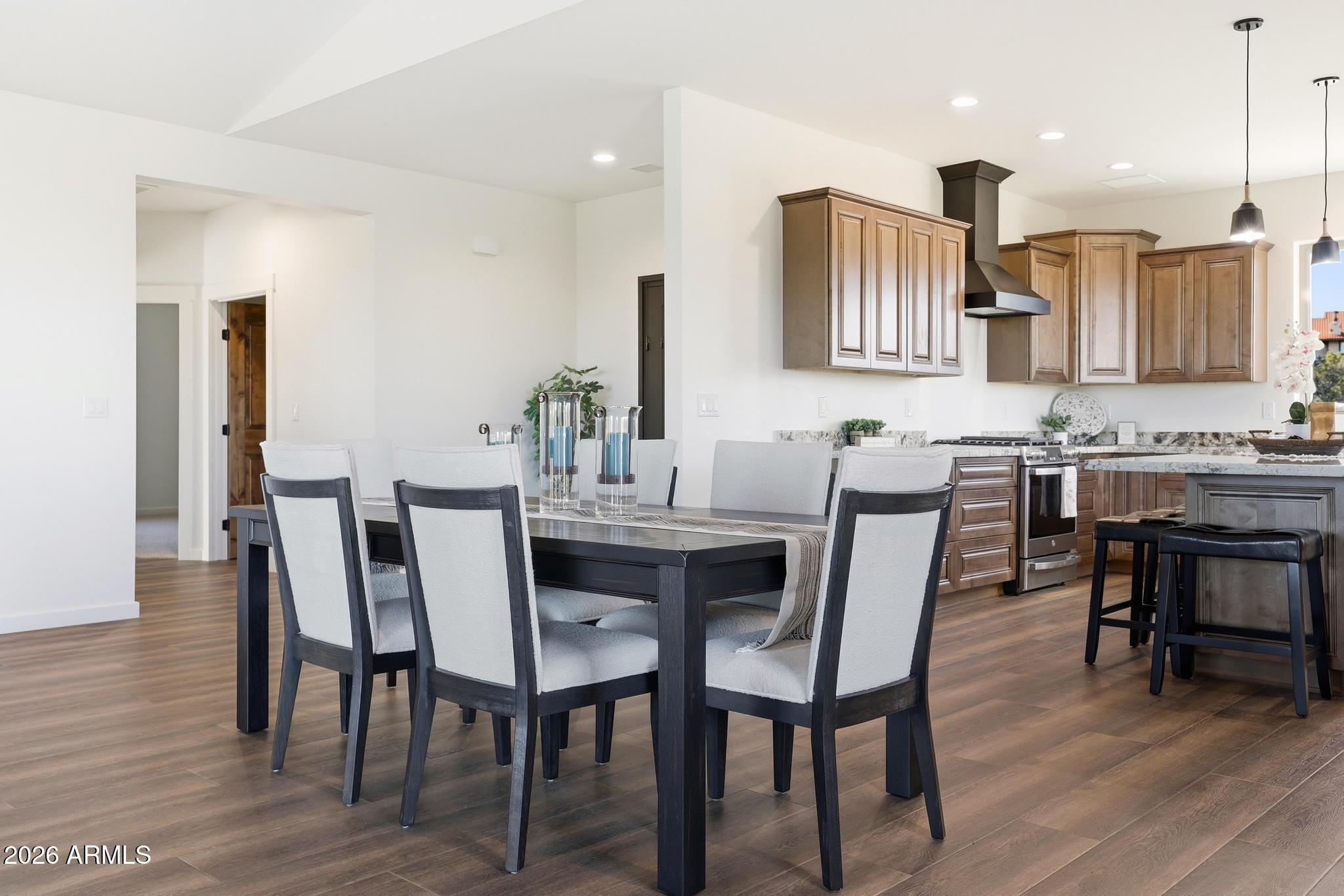 1105 South Kinzer Court Payson, AZ 85541 - Photo 14 of 44 a view of a dining room with furniture and wooden floor