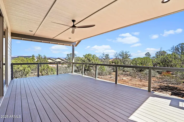 a view of a balcony with wooden floor