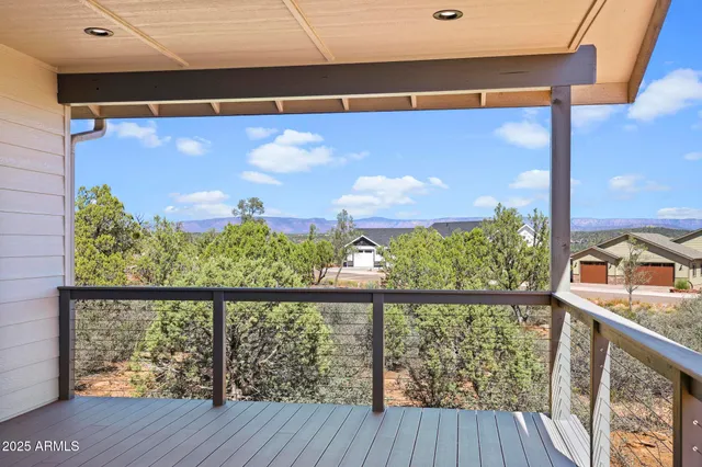 a view of a balcony with wooden floor