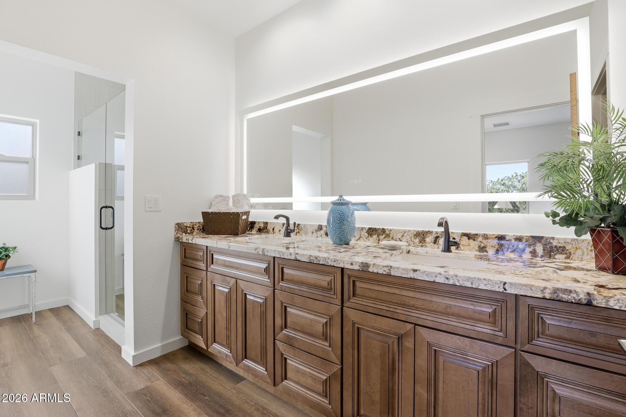 1105 South Kinzer Court Payson, AZ 85541 - Photo 23 of 44 a bathroom with a granite countertop sink and a mirror
