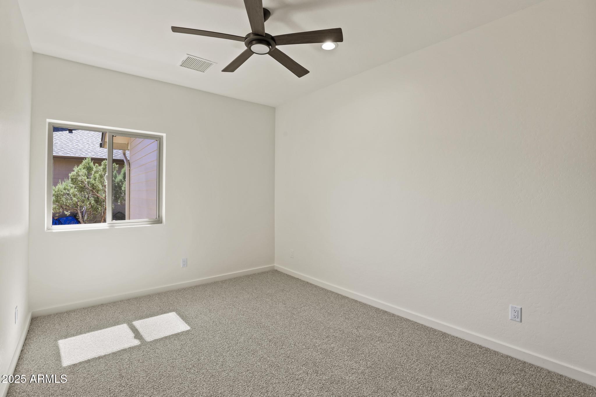 1105 South Kinzer Court Payson, AZ 85541 - Photo 27 of 44 a view of room with window and ceiling fan