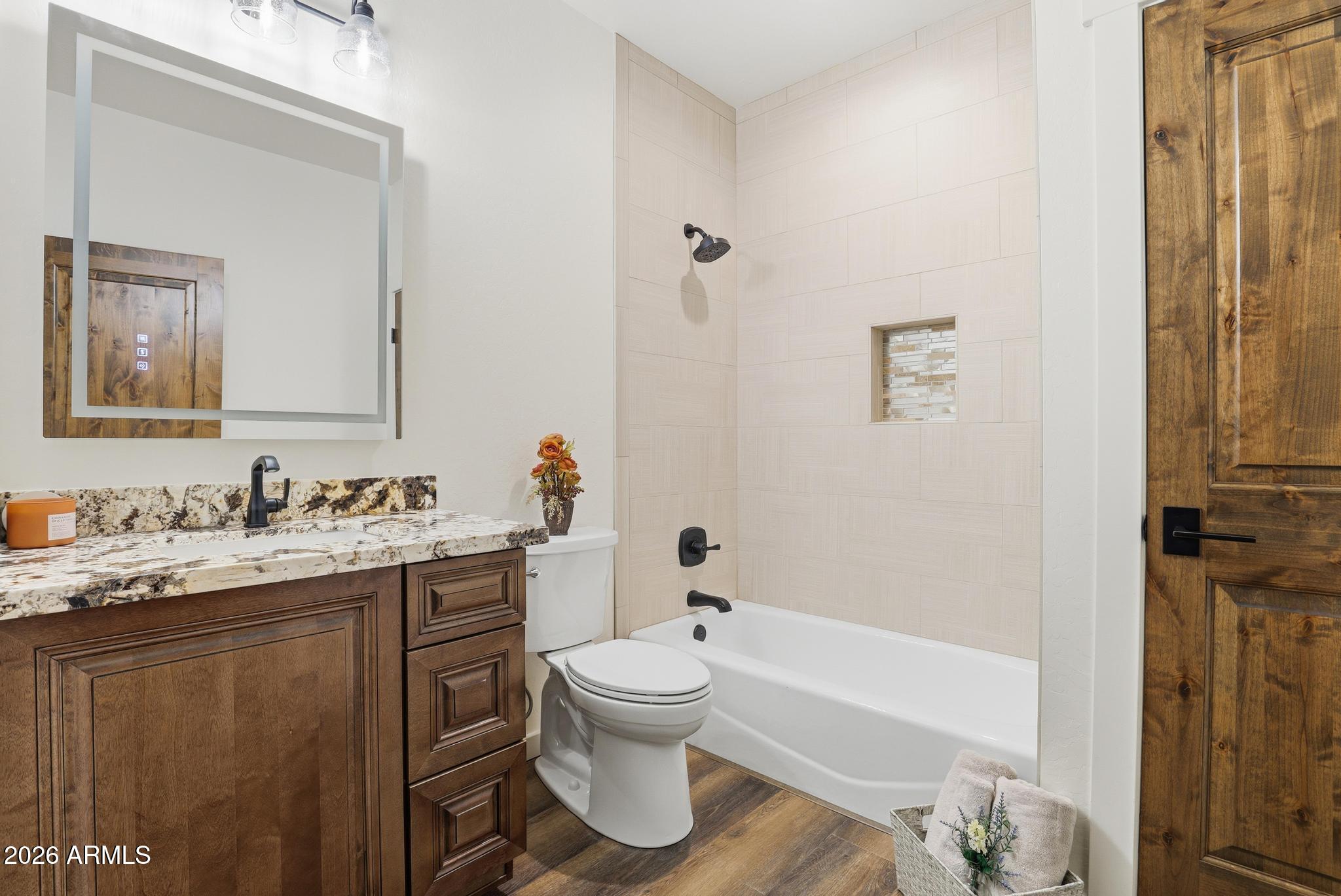 1105 South Kinzer Court Payson, AZ 85541 - Photo 28 of 44 a bathroom with a granite countertop sink toilet and shower