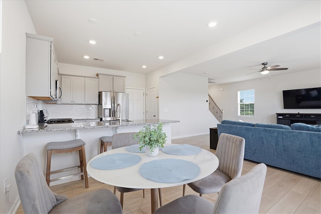 365 Sliding Rock Drive Pendleton, SC 29670 - Photo 10 of 46 An inviting open-concept layout seamlessly connects the kitchen and living spaces, perfect for entertaining.