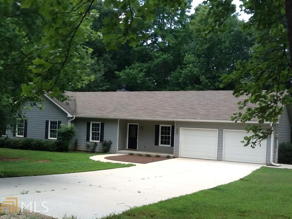 294 Goolsby Road Carnesville, GA 30521 - Photo 1 of 1 a house that has a tree in front of it