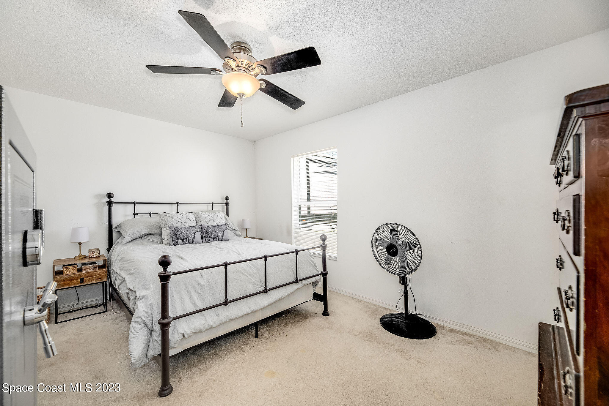 6342 Hudson Road Cocoa, FL 32927 - Photo 11 of 30 a bedroom with a bed and window