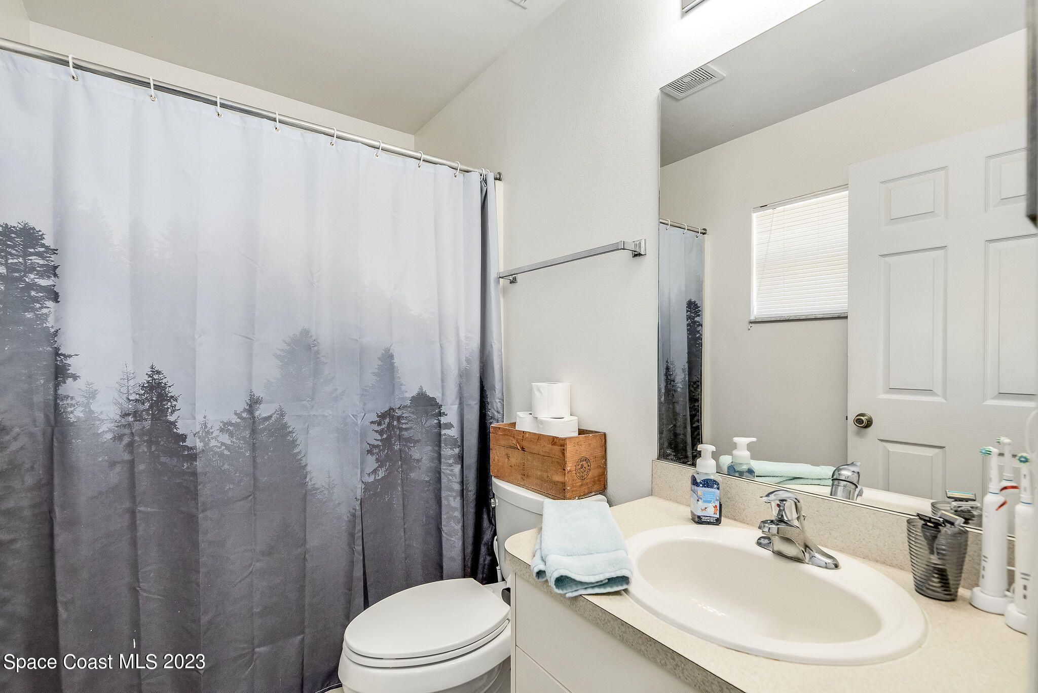 6342 Hudson Road Cocoa, FL 32927 - Photo 13 of 30 a bathroom with a sink toilet and shower