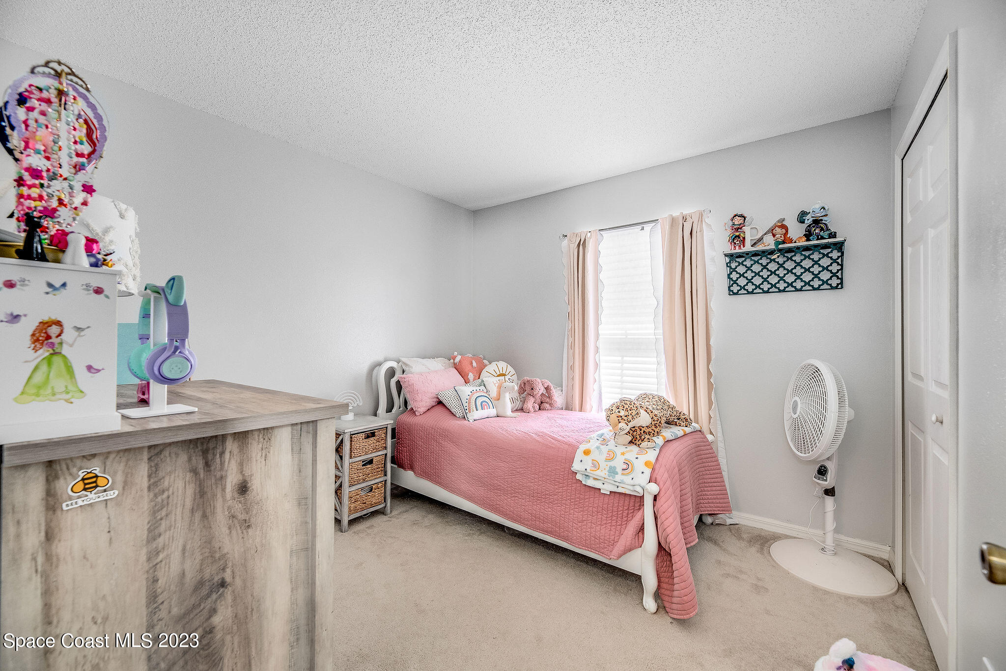 6342 Hudson Road Cocoa, FL 32927 - Photo 14 of 30 a bedroom with a bed and a window