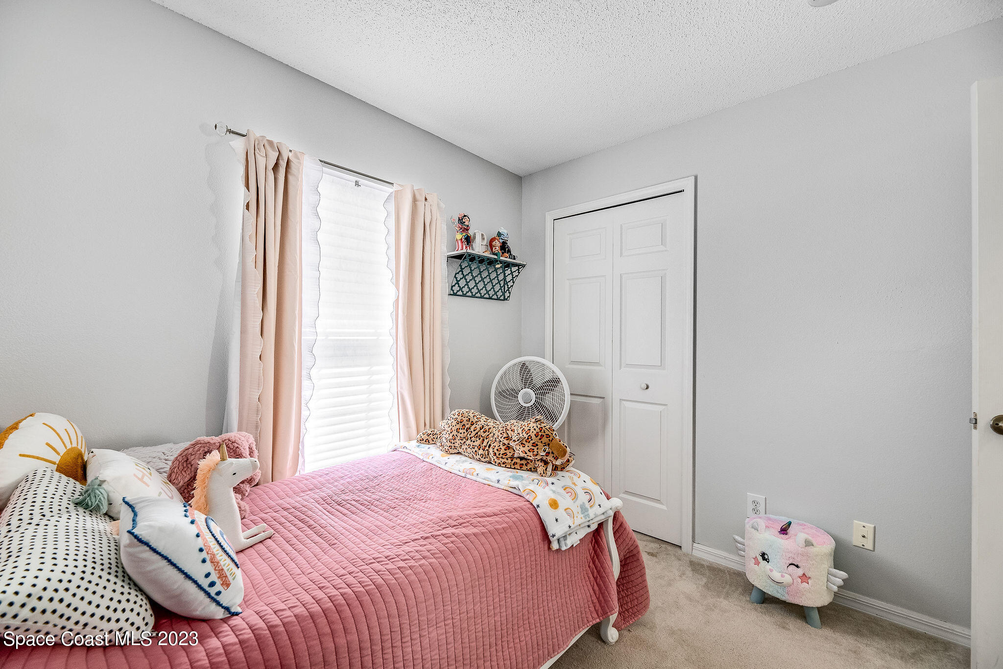 6342 Hudson Road Cocoa, FL 32927 - Photo 15 of 30 a bedroom with a bed and wooden floor