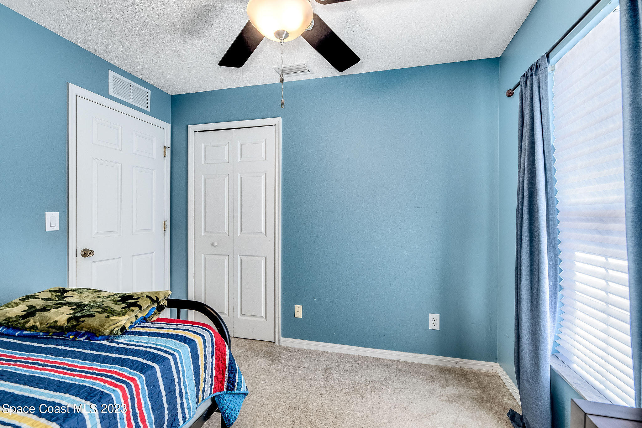 6342 Hudson Road Cocoa, FL 32927 - Photo 18 of 30 a bedroom with a bed and a window