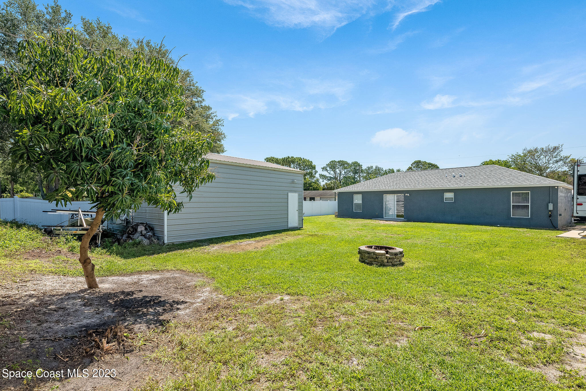 6342 Hudson Road Cocoa, FL 32927 - Photo 24 of 30 a view of a house with a yard