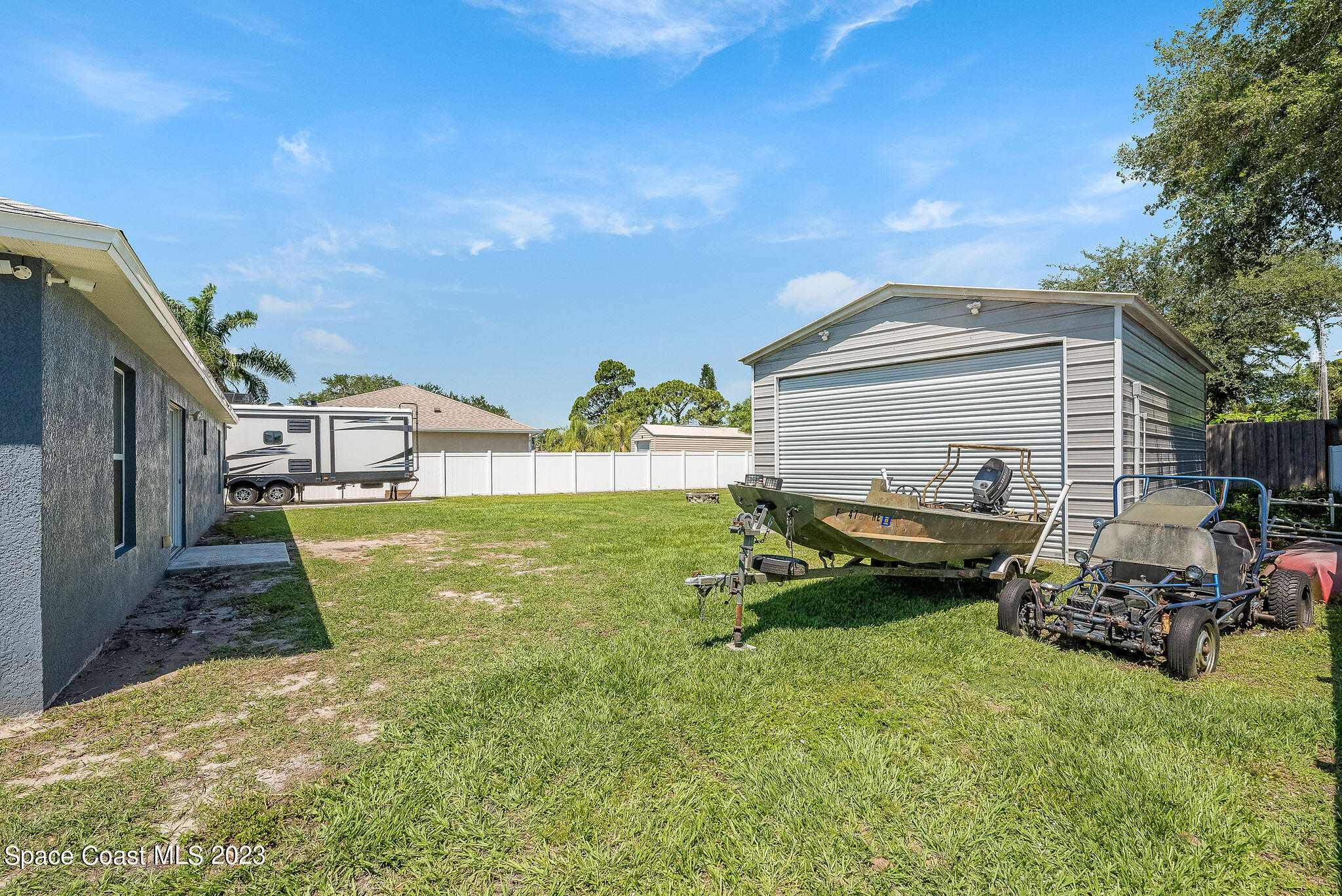 6342 Hudson Road Cocoa, FL 32927 - Photo 26 of 30 a view of a backyard with a car parked in it