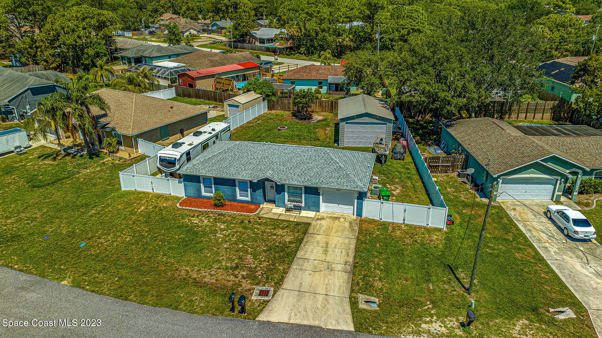 6342 Hudson Road Cocoa, FL 32927 - Photo 27 of 30 an aerial view of residential houses with outdoor space and trees
