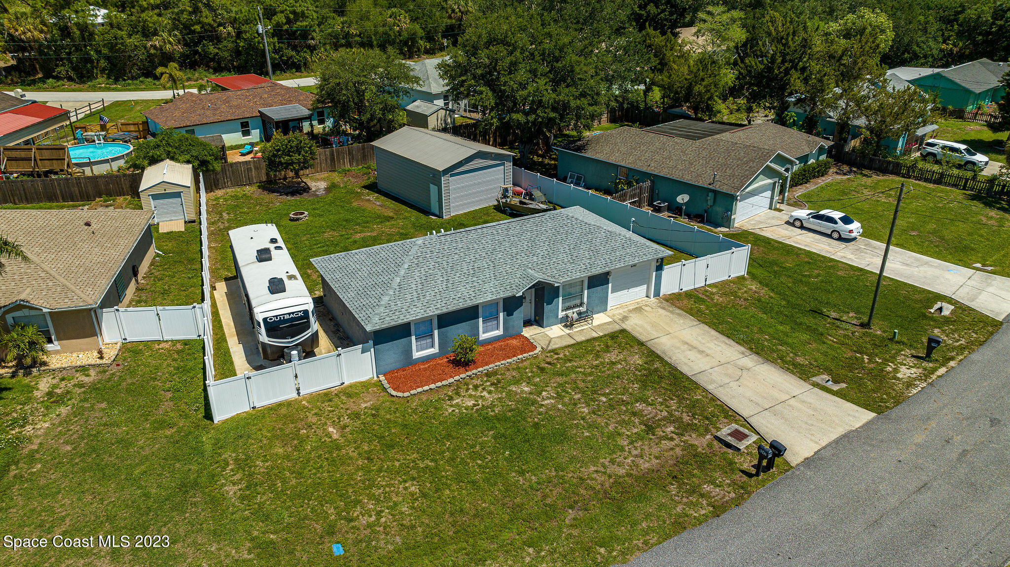 6342 Hudson Road Cocoa, FL 32927 - Photo 28 of 30 an aerial view of a house with swimming pool garden and patio