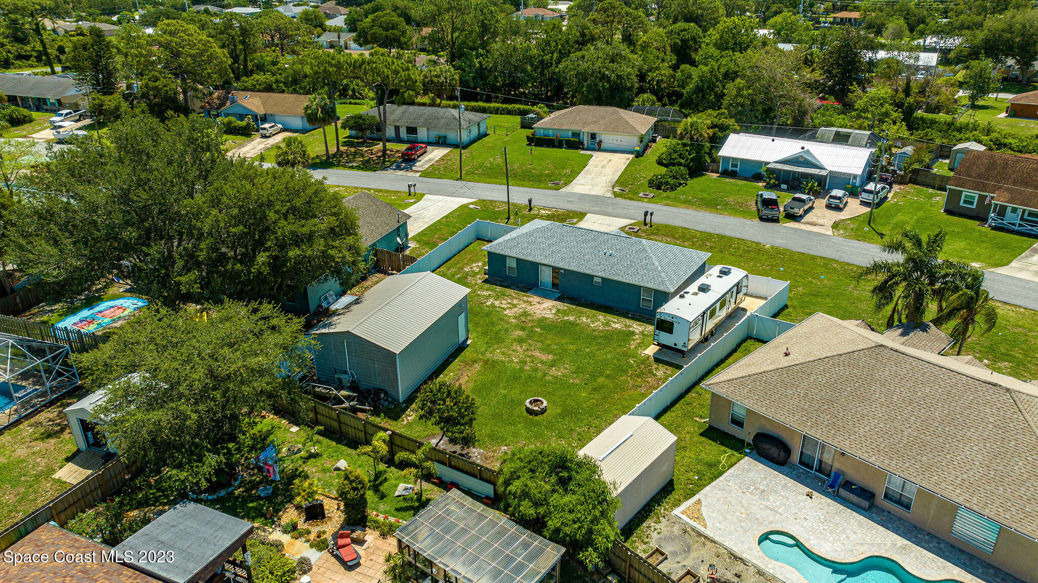 6342 Hudson Road Cocoa, FL 32927 - Photo 29 of 30 an aerial view of a house with swimming pool and outdoor seating