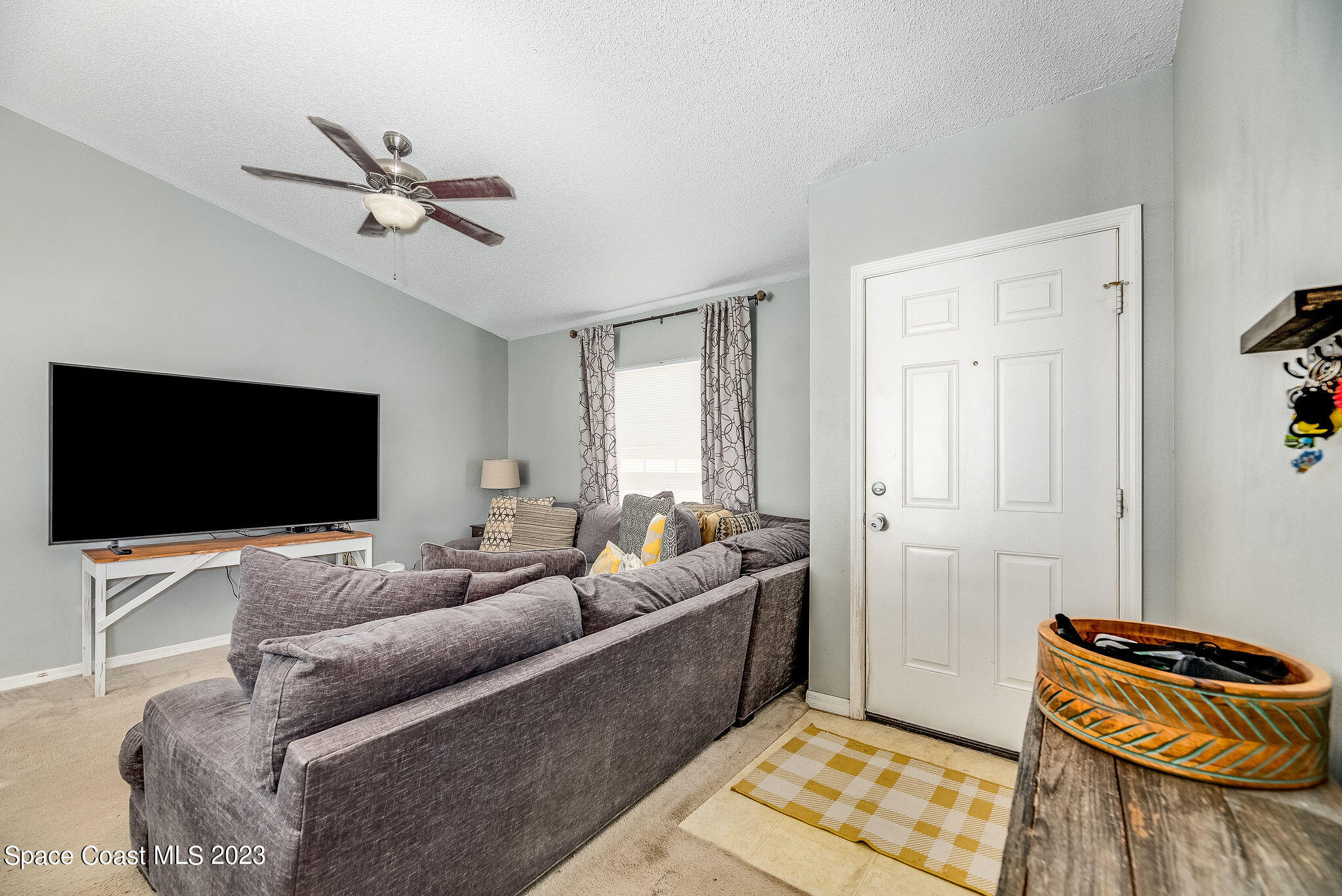 6342 Hudson Road Cocoa, FL 32927 - Photo 4 of 30 a living room with furniture and a flat screen tv