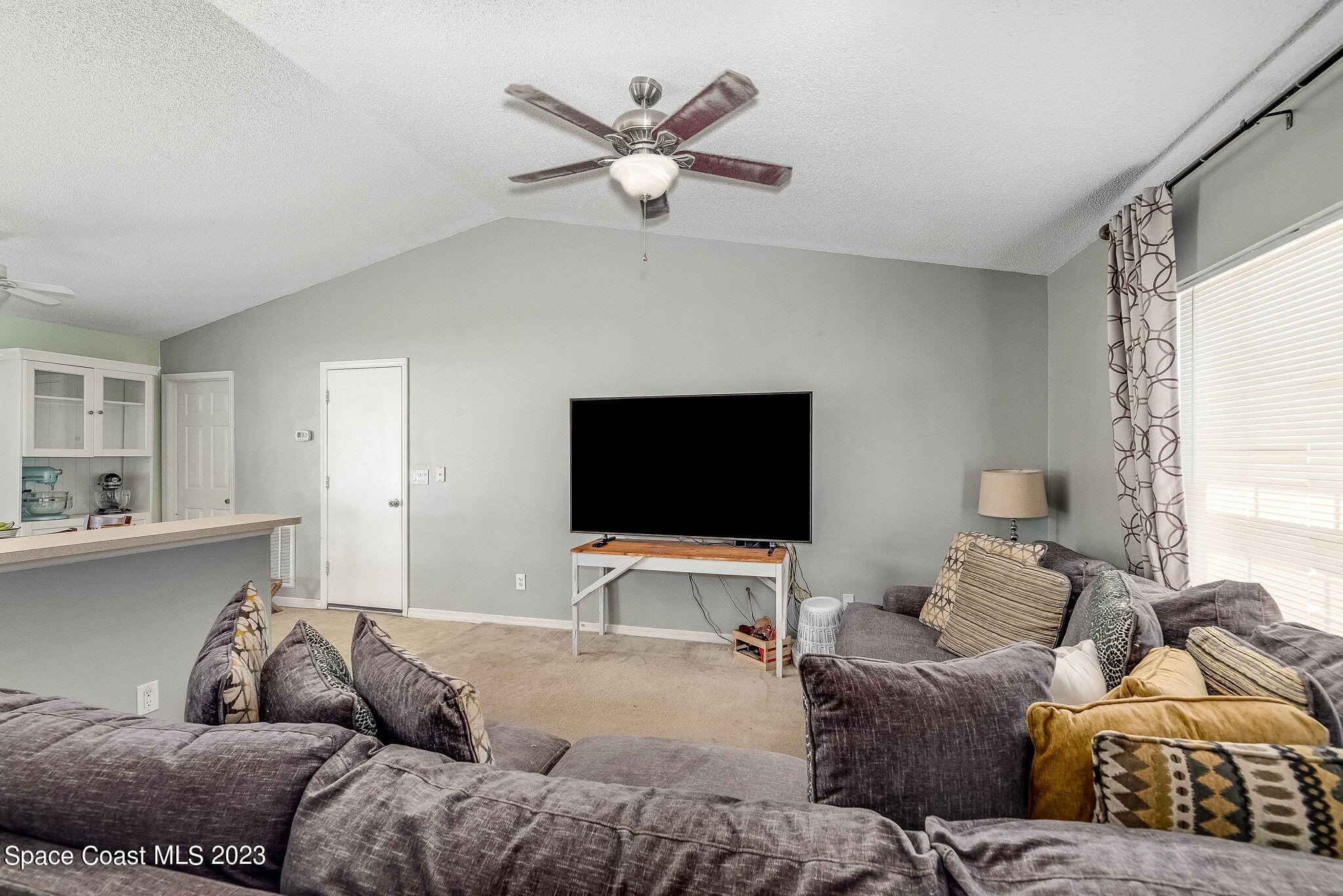 6342 Hudson Road Cocoa, FL 32927 - Photo 6 of 30 a living room with furniture and a flat screen tv