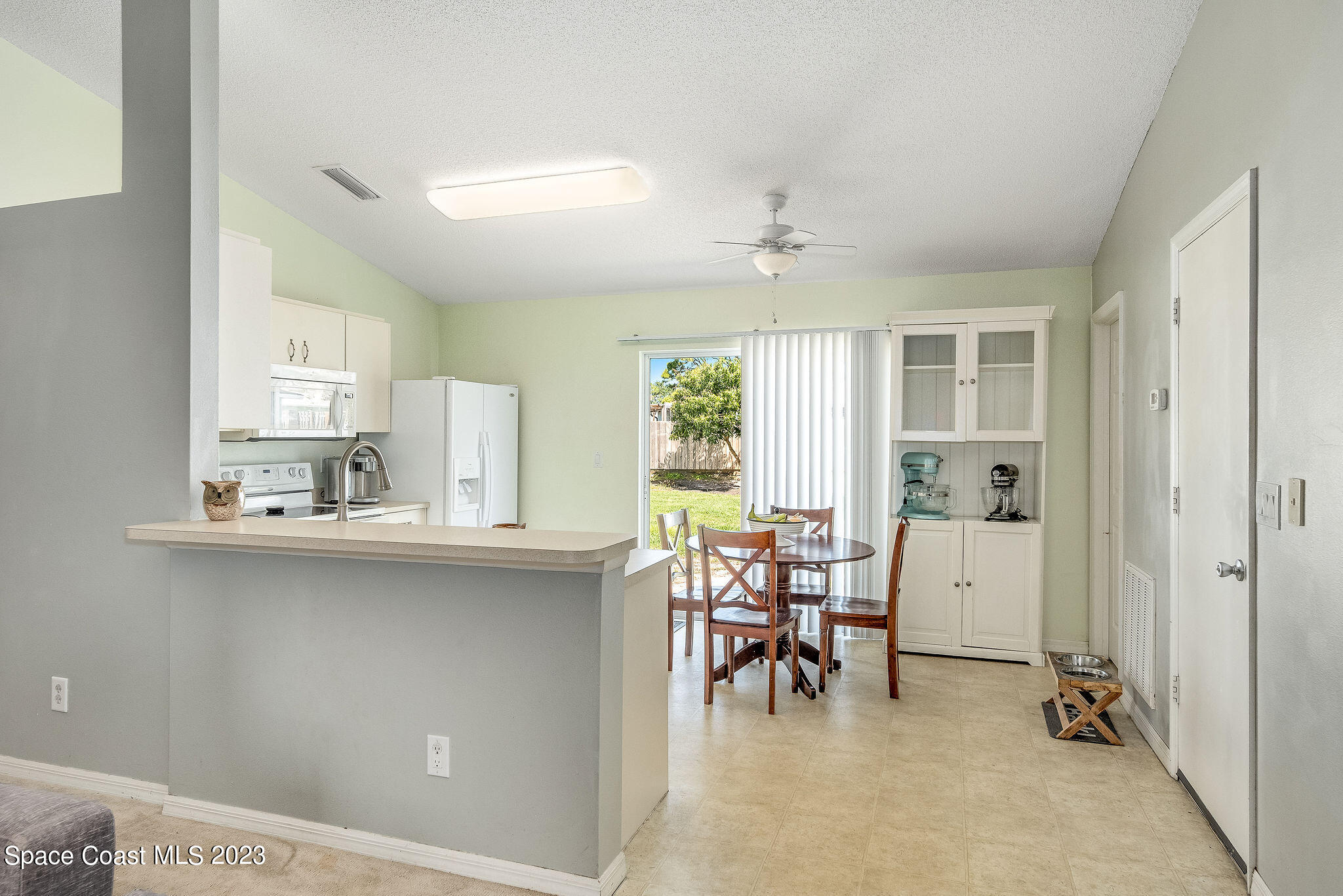 6342 Hudson Road Cocoa, FL 32927 - Photo 7 of 30 a view of a dining room with furniture and a large window