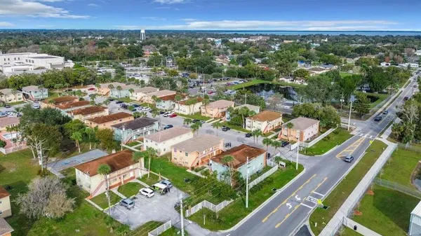 an aerial view of residential houses with outdoor space