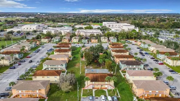 an aerial view of residential houses with outdoor space