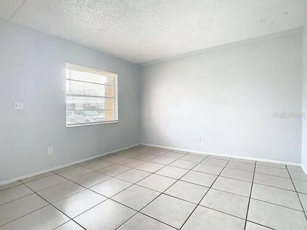 a view of an empty room and window