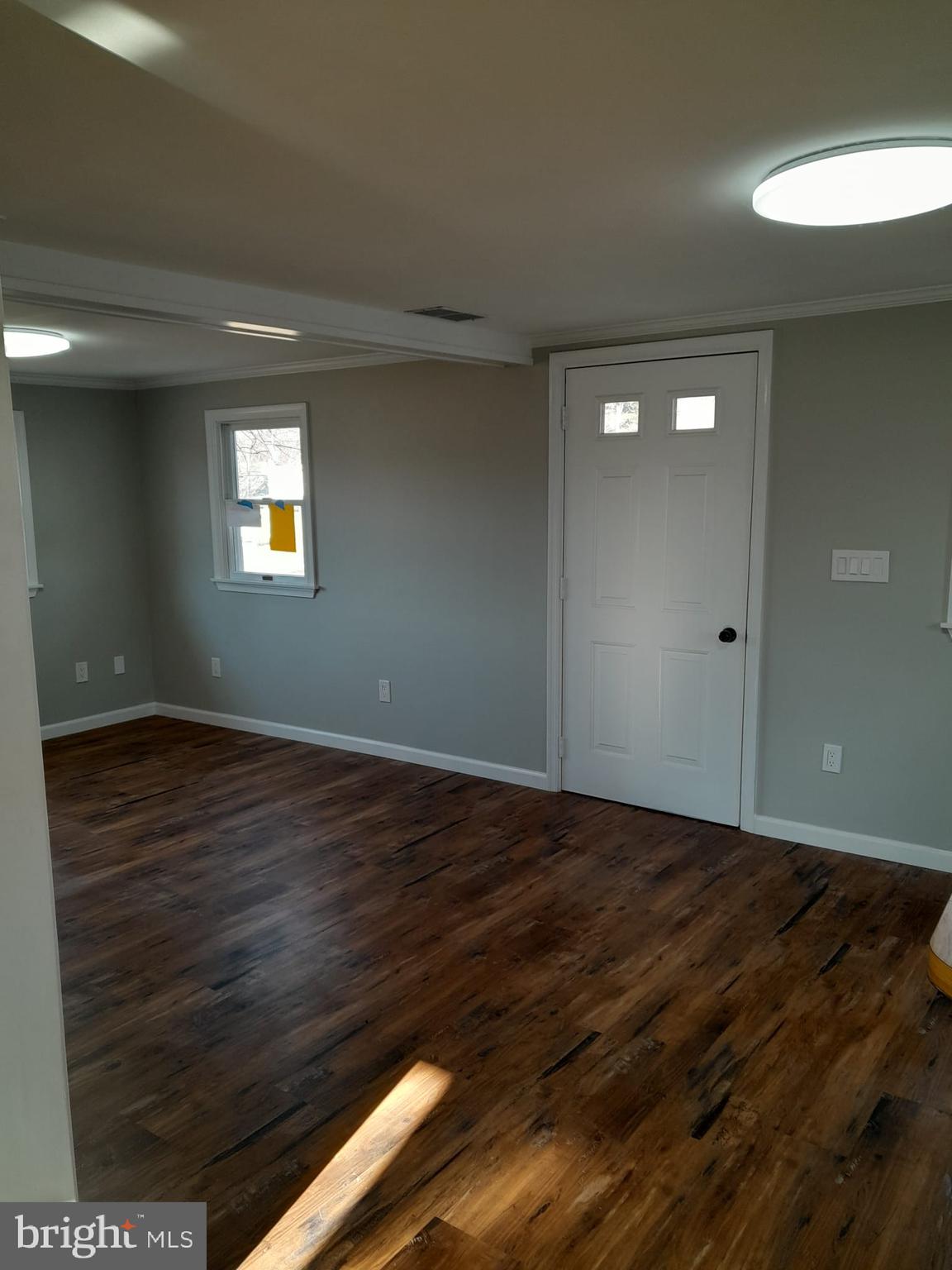 1656 Chestnut Ridge Road Upper Black Eddy, PA 18972 - Photo 14 of 32 a view of an empty room with wooden floor and a window