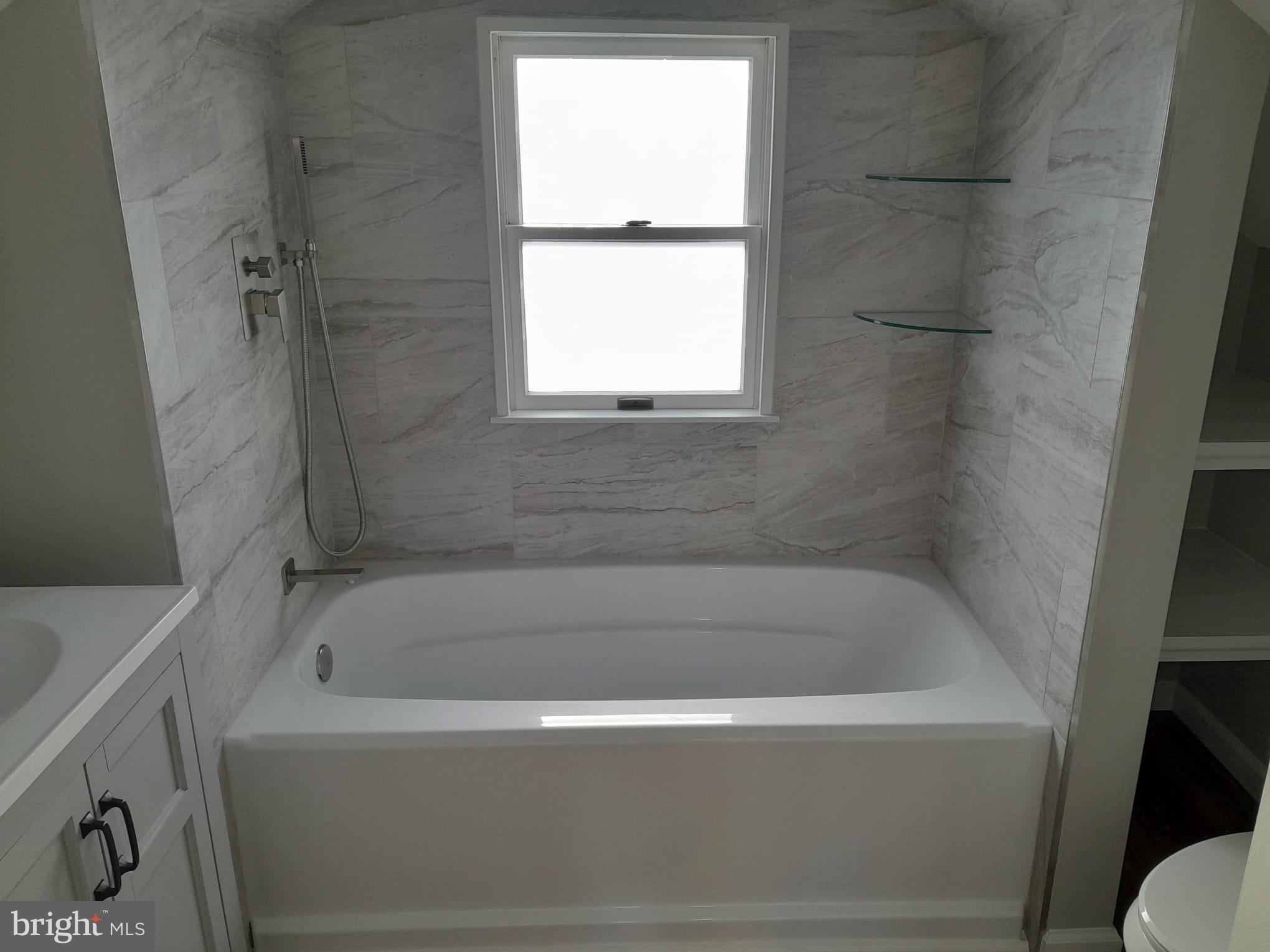 1656 Chestnut Ridge Road Upper Black Eddy, PA 18972 - Photo 25 of 32 a white bath tub sitting next to a window