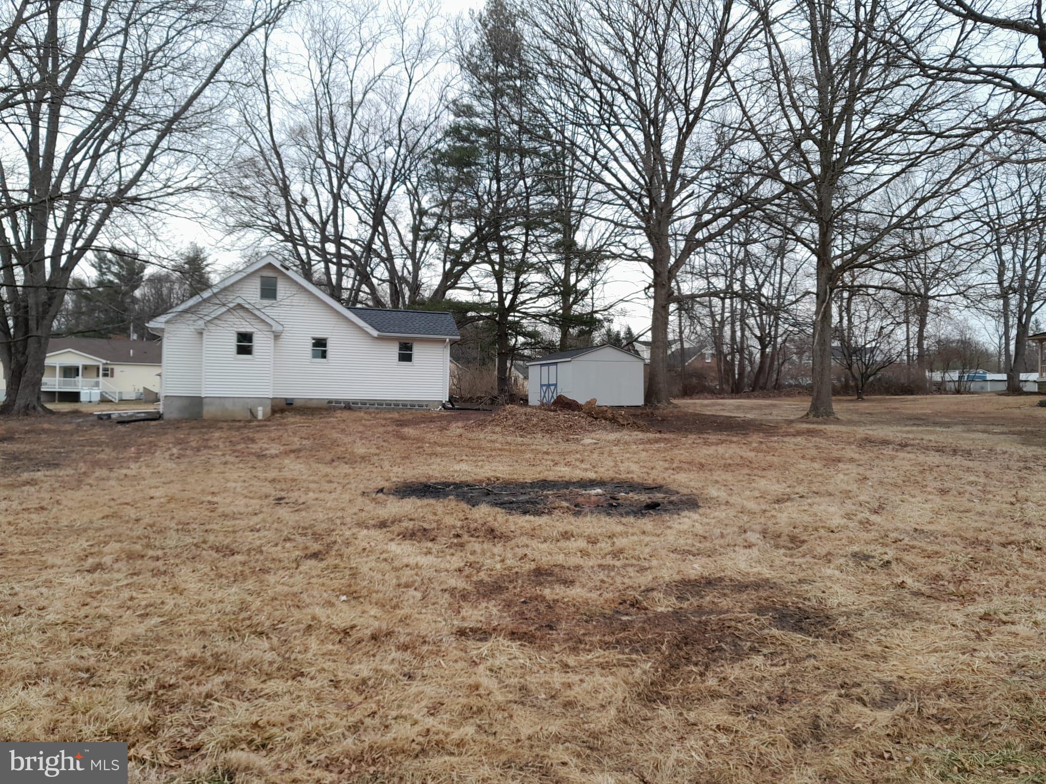 1656 Chestnut Ridge Road Upper Black Eddy, PA 18972 - Photo 5 of 32 a white house that has a tree in front of it