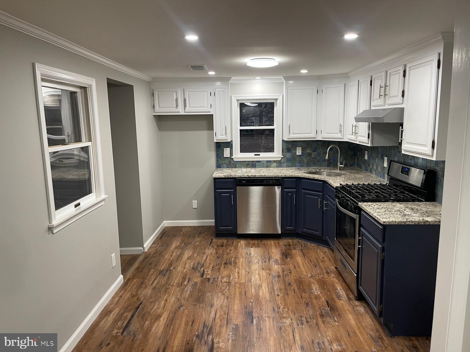 1656 Chestnut Ridge Road Upper Black Eddy, PA 18972 - Photo 7 of 32 a kitchen with stainless steel appliances granite countertop a stove a sink and a refrigerator