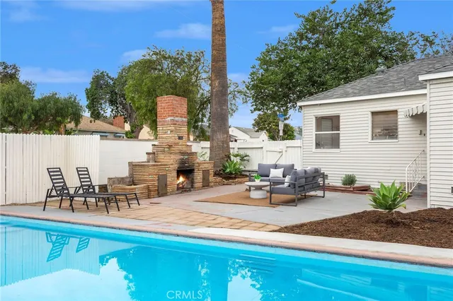 a view of a chairs and table in patio