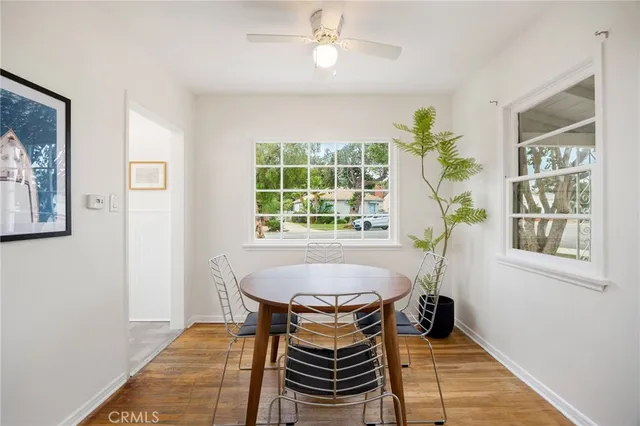 a dining room with a window and furniture