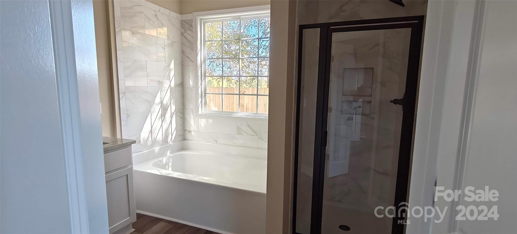 9649 Stokes Ferry Road Gold Hill, NC 28071 - Photo 12 of 17 a bathroom with a bathtub