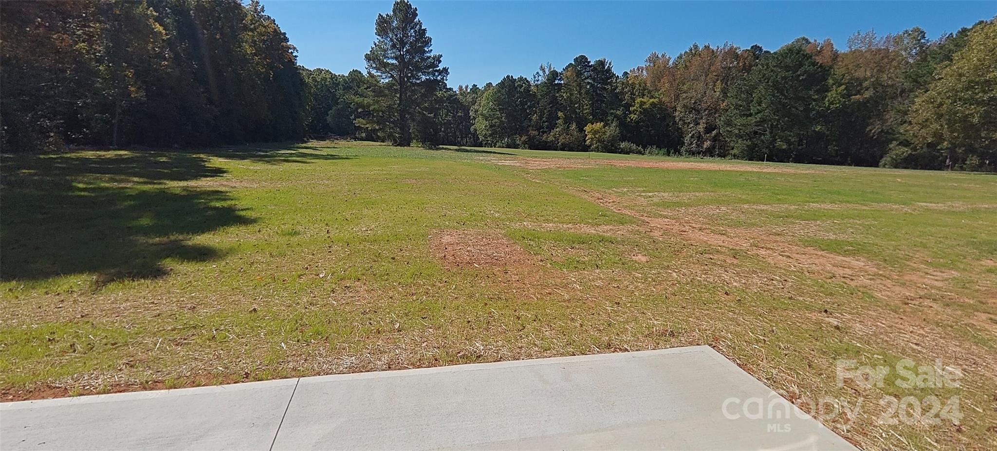 9649 Stokes Ferry Road Gold Hill, NC 28071 - Photo 2 of 17 a view of a yard with an outdoor space