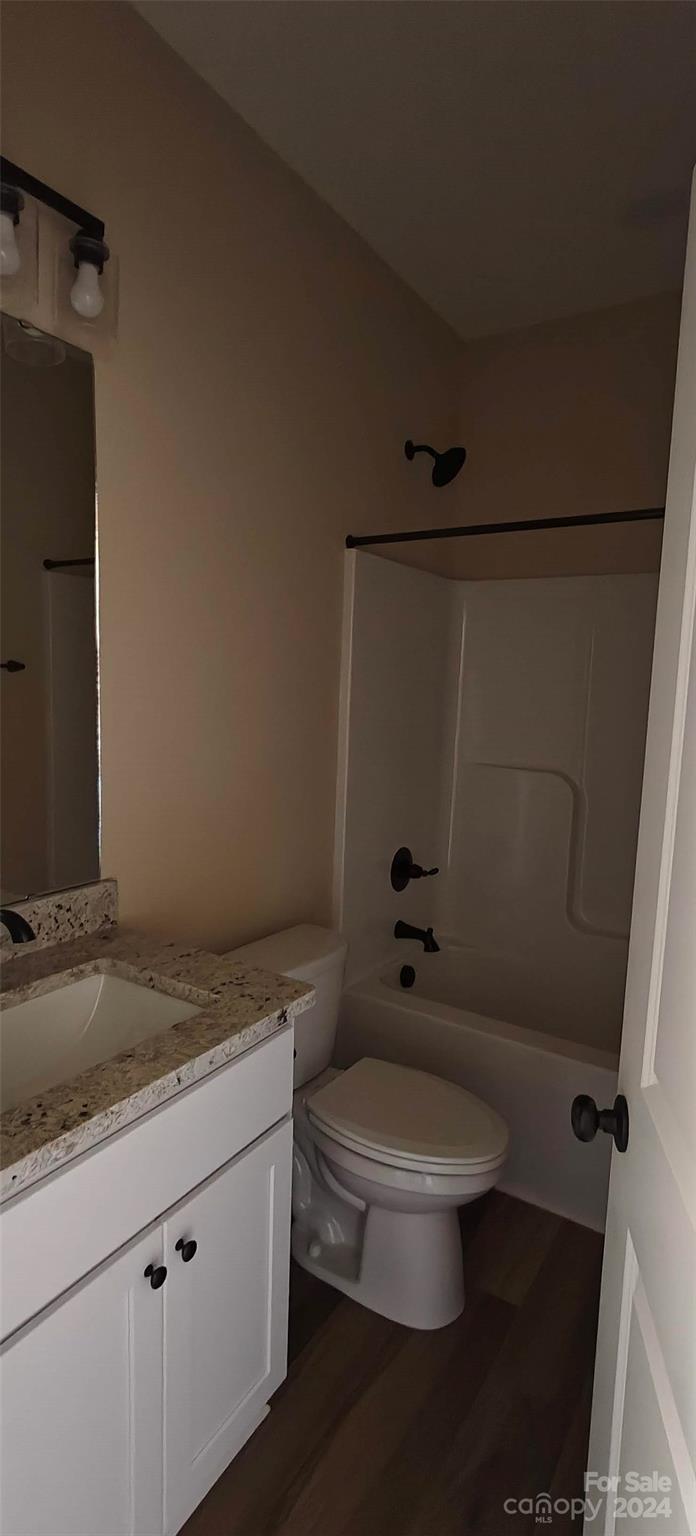 9649 Stokes Ferry Road Gold Hill, NC 28071 - Photo 9 of 17 a bathroom with a granite countertop toilet sink and shower