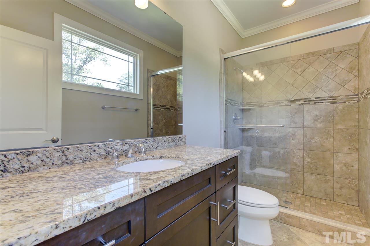 422 Heather Drive Raleigh, NC 27606 - Photo 21 of 30 Primary Bathroom with Walk-in Shower