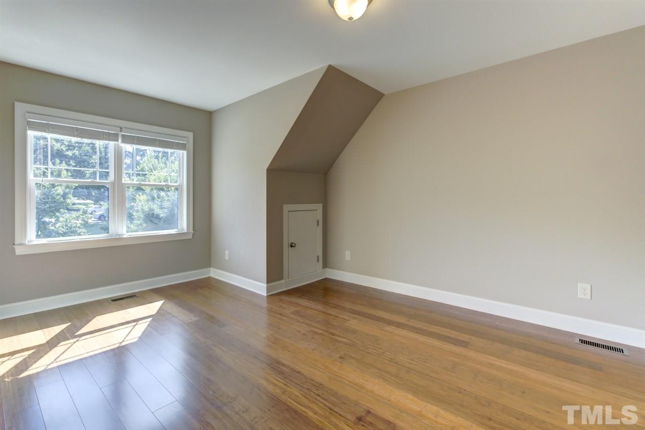 422 Heather Drive Raleigh, NC 27606 - Photo 24 of 30 Bedroom with eaves area storage.