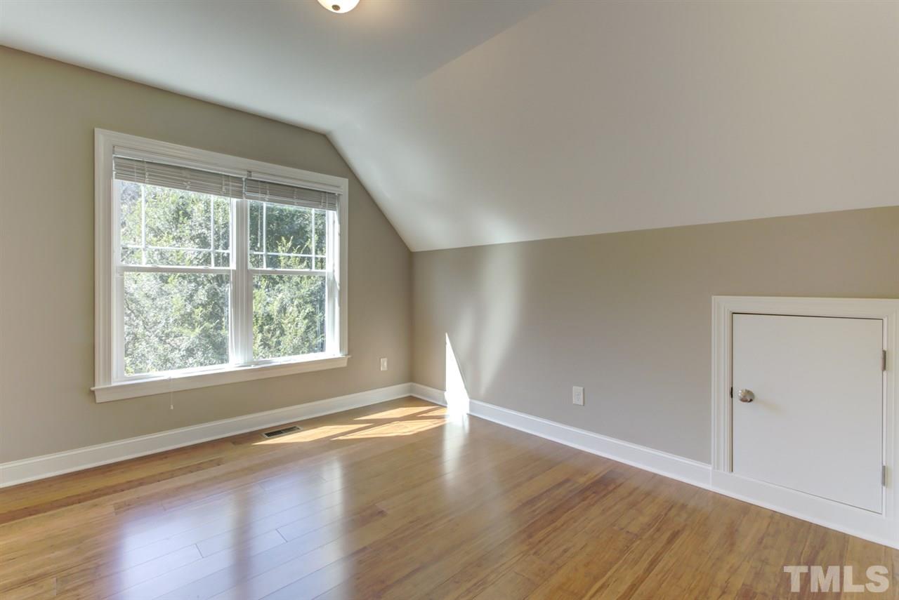 422 Heather Drive Raleigh, NC 27606 - Photo 25 of 30 Bedroom with eaves area storage.