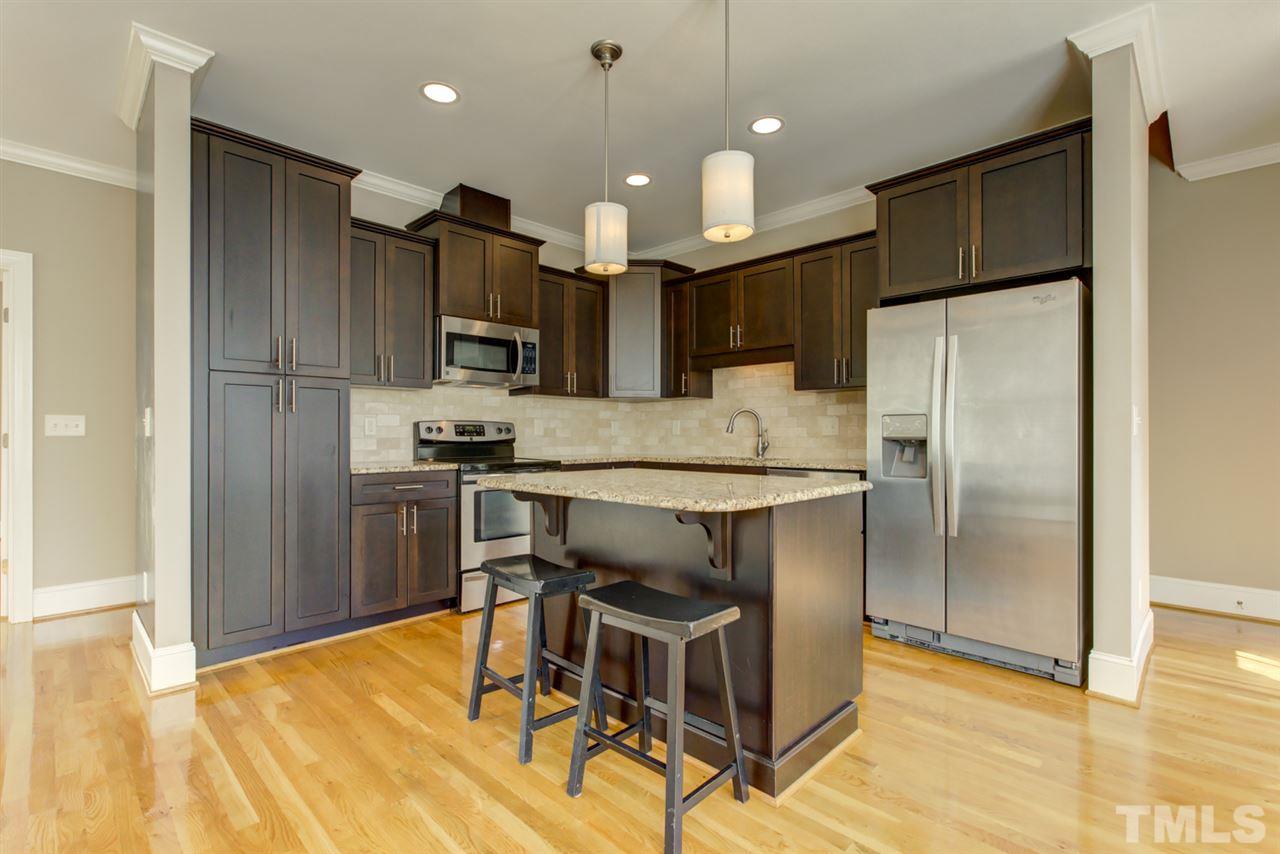 422 Heather Drive Raleigh, NC 27606 - Photo 6 of 30 Notice the Island with Bar Seating