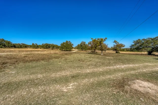 a view of a lake with a big yard