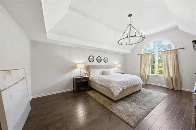 a picture of a room with a white wall and a painting